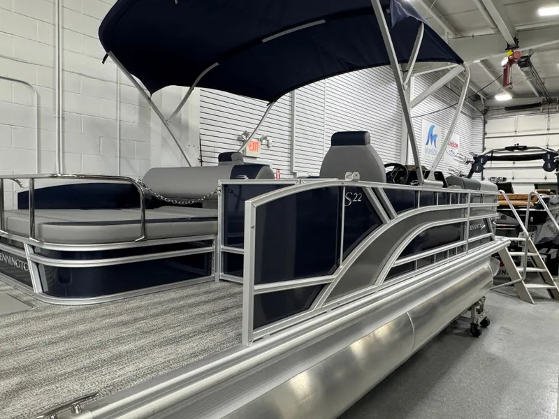 Slide: The Image of 2025 Bennington 22 SSB pontoon boat with canopy in showroom. - 20