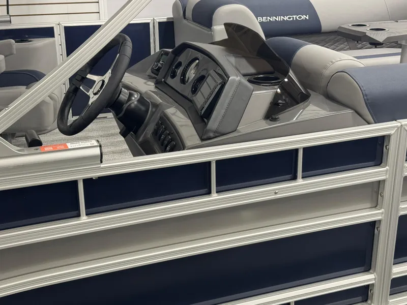 Slide: The Image of 2025 Bennington 22 SSB pontoon boat interior with steering console and seating. - 21