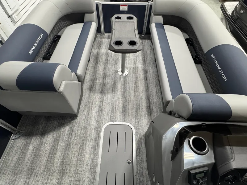 Slide: The Image of 2025 Bennington 22 SSB pontoon boat interior with gray seating and central table. - 6