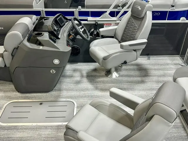 Slide: The Image of 2025 Bennington 22 SSB boat interior with modern helm and plush seating. - 10