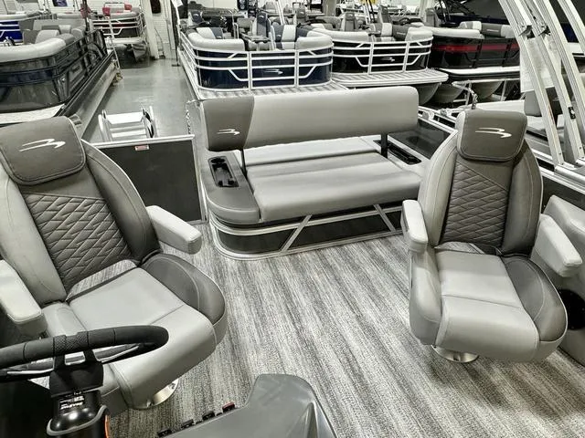 Slide: The Image of 2025 Bennington 22 SSB pontoon boat interior with gray seating and modern design. - 14