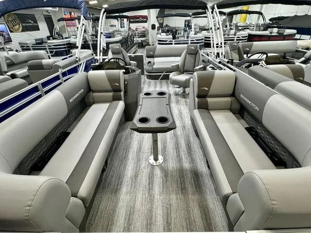 Slide: The Image of 2025 Bennington 22 SSB pontoon boat interior with gray seating and central table. - 15