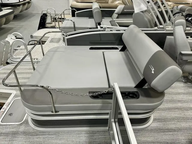 Slide: The Image of 2025 Bennington 22 SSB pontoon boat with gray seating and sleek design. - 17