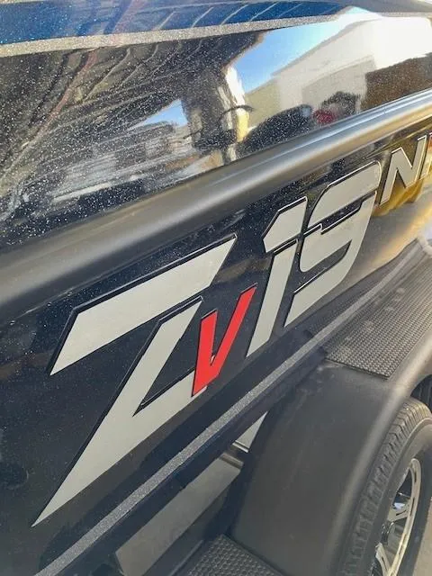 Slide: The Image of 2025 Nitro ZV19 boat with sleek black exterior and bold red accents. - 1