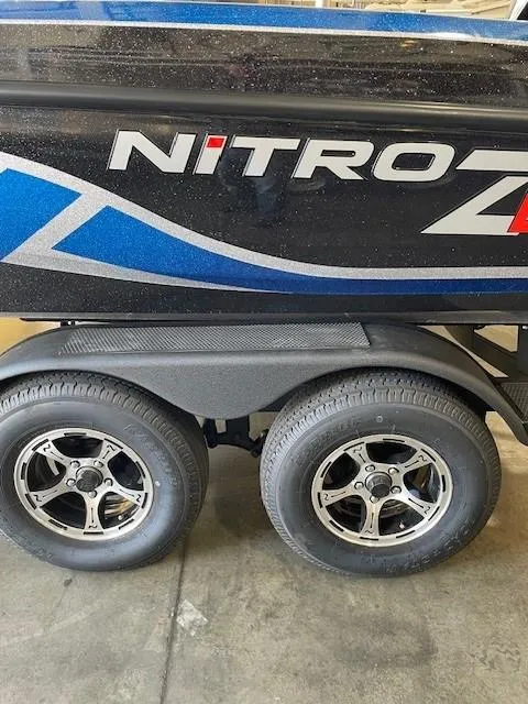 Slide: The Image of 2025 Nitro ZV19 boat trailer with dual wheels and sleek design. - 2
