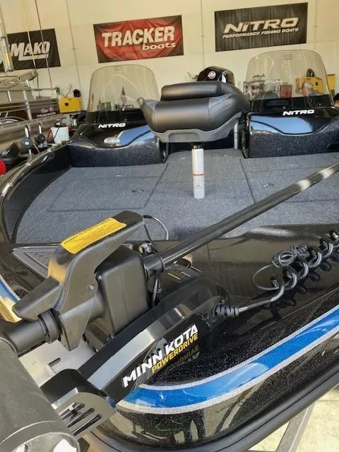Slide: The Image of 2025 Nitro ZV19 fishing boat with Minn Kota PowerDrive motor in showroom. - 7