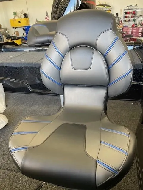 Slide: The Image of 2025 Nitro ZV19 boat seat with sleek black and blue design. - 8