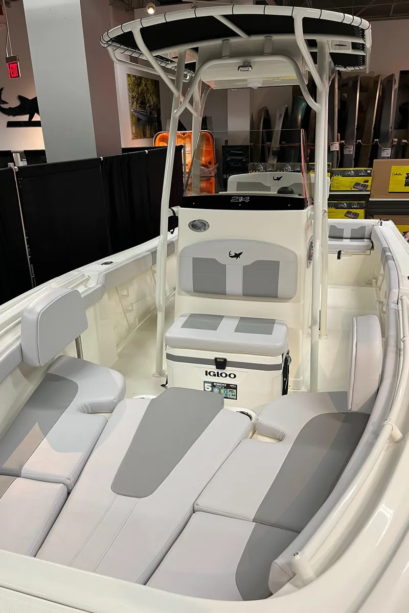 Slide: The Image of 2025 Mako 214 CC boat with spacious seating and modern design. - 5