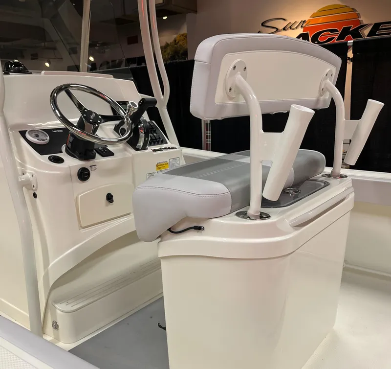 Slide: The Image of 2025 Mako 214 CC boat interior with steering wheel and seating. - 6
