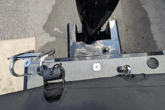 Slide: The Image of 2025 Regency 250 LE3 boat stern view with motor and deck details. - 5