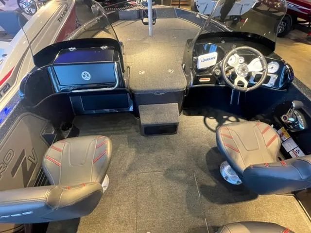 Slide: The Image of 2025 Nitro ZV19 boat interior with steering wheel, seats, and dashboard. - 8
