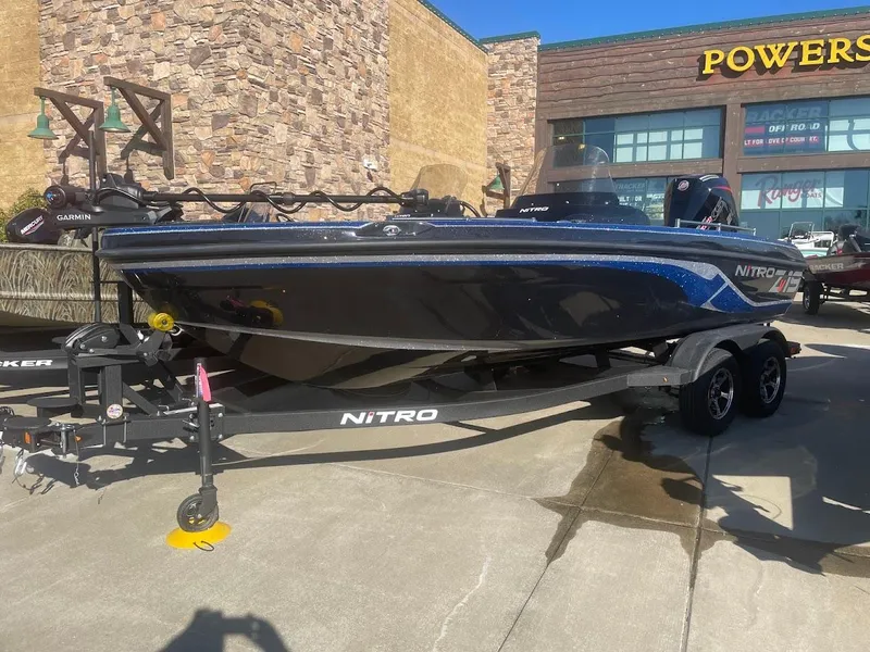The Image of 2025 Nitro ZV19 boat on trailer outside a store. - 0
