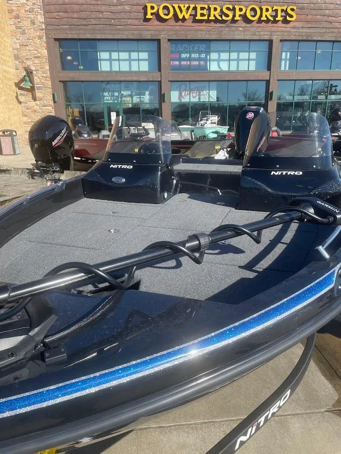 Slide: The Image of 2025 Nitro ZV19 boat displayed at Powersports dealership. - 2