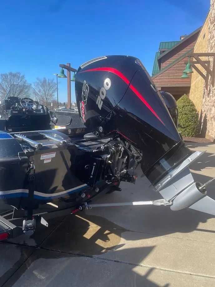 Slide: The Image of 2025 Nitro ZV19 boat with powerful outboard motor, parked outdoors. - 3