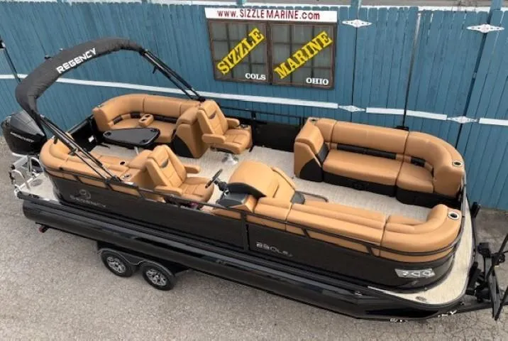 The Image of 2025 Regency 230 LE3 pontoon boat with tan seating, displayed at Sizzle Marine, Ohio. - 0
