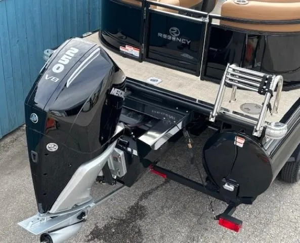Slide: The Image of 2025 Regency 230 LE3 boat with Mercury V8 outboard motor, rear view. - 13