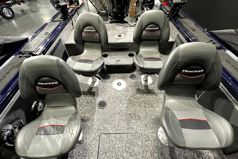 Slide: The Image of 2025 Tracker Targa V-19 WT boat interior with four gray seats. - 20