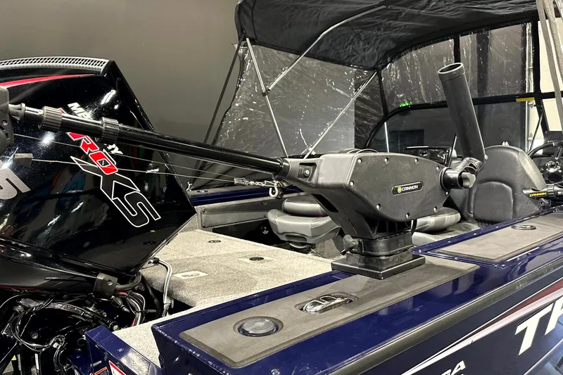 Slide: The Image of 2025 Tracker Targa V-19 WT boat interior with fishing rod holder and motor. - 8