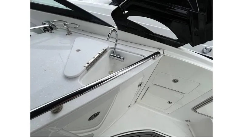 Slide: The Image of 2018 Monterey M65 boat interior with sleek white design and chrome accents. - 11