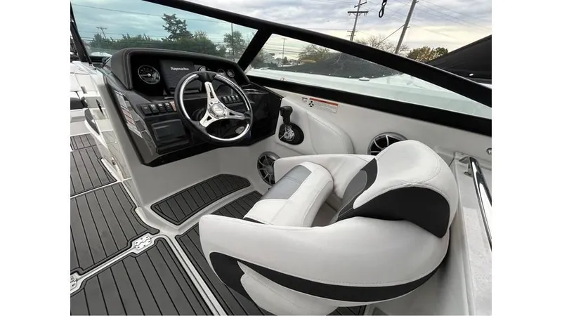 Slide: The Image of 2018 Monterey M65 boat interior with steering wheel and seating. - 12