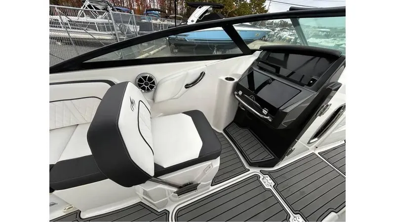 Slide: The Image of 2018 Monterey M65 boat interior with sleek seating and modern dashboard design. - 14