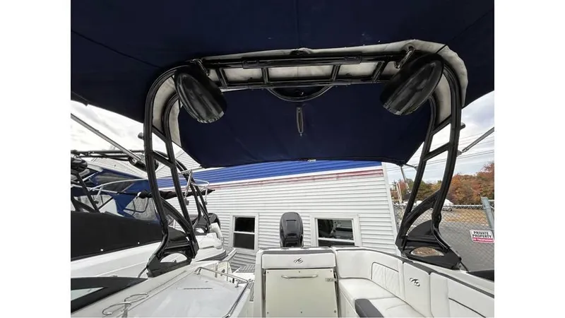 Slide: The Image of 2018 Monterey M65 boat interior with canopy and seating area. - 20