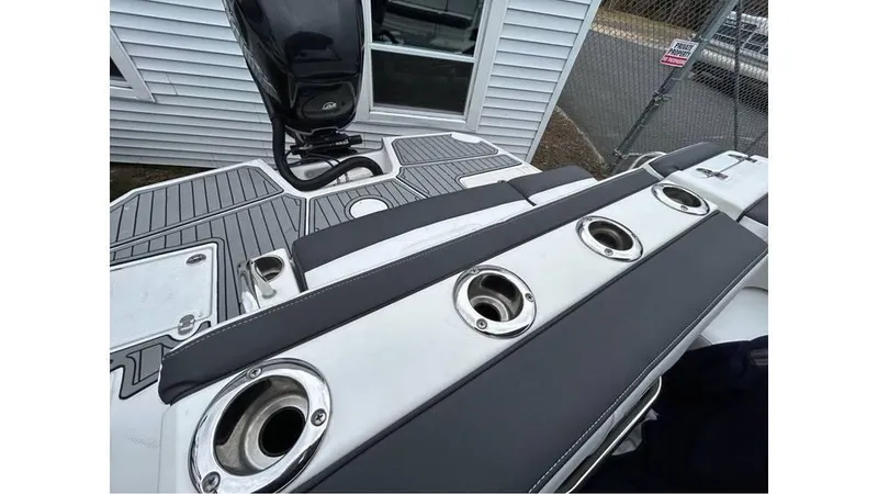 Slide: The Image of Monterey M65 2018 boat deck with rod holders and seating area. - 22