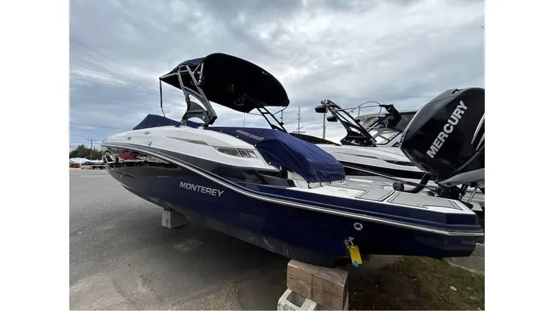 Slide: The Image of 2018 Monterey M65 boat with Mercury engine, parked on wooden blocks. - 4