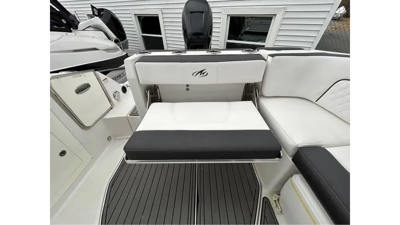 Slide: The Image of 2018 Monterey M65 boat interior with white and black seating, modern design. - 8