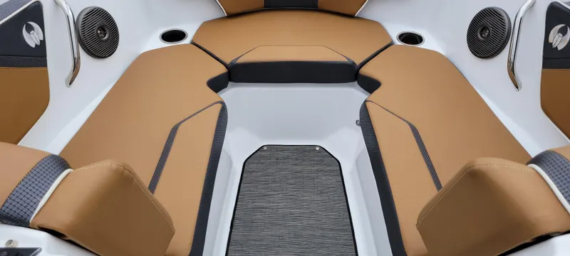 Slide: The Image of Interior seating of 2021 Scarab 215 ID boat with tan upholstery and speakers. - 11