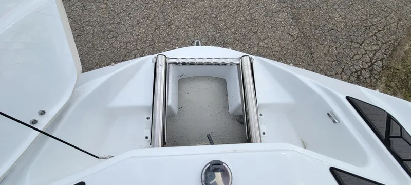 Slide: The Image of 2021 Scarab 215 ID boat bow with anchor storage and stainless steel fittings. - 14