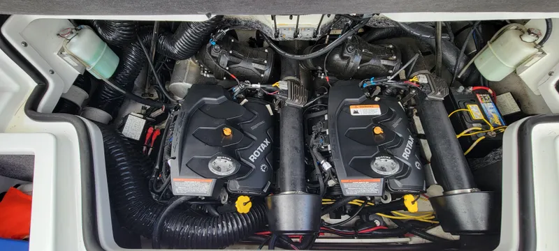 Slide: The Image of 2021 Scarab 215 ID engine compartment with dual Rotax engines and components. - 22