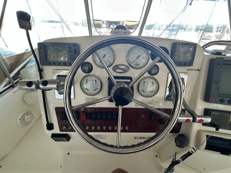 Slide: The Image of 2002 Silverton 35 Convertible helm with gauges and navigation equipment. - 10