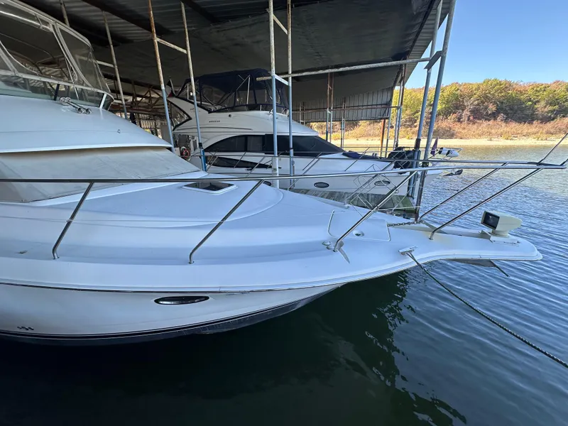 Slide: The Image of 2002 Silverton 35 Convertible yacht docked in marina. - 6