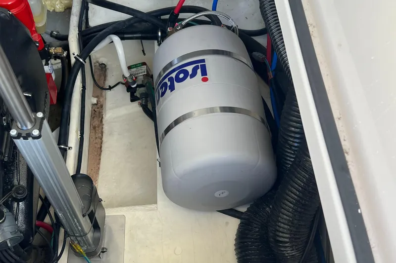 Slide: The Image of 2021 Regal 28 Express engine compartment with Isotemp water heater. - 11