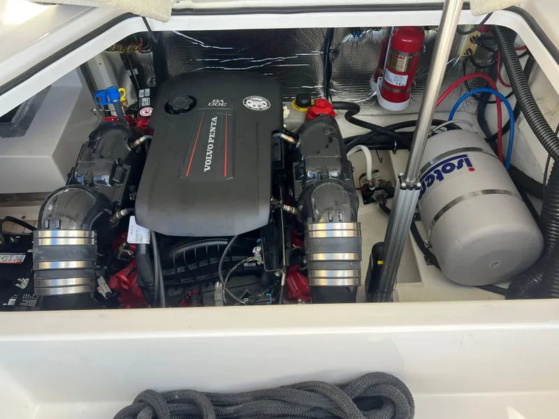 Slide: The Image of Engine compartment of a 2021 Regal 28 Express boat with Volvo Penta engine. - 13