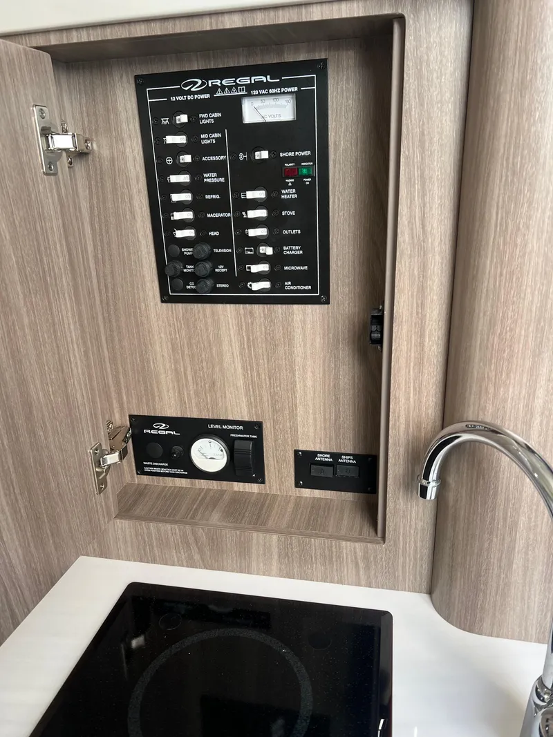 Slide: The Image of Control panel of a 2021 Regal 28 Express boat interior. - 23