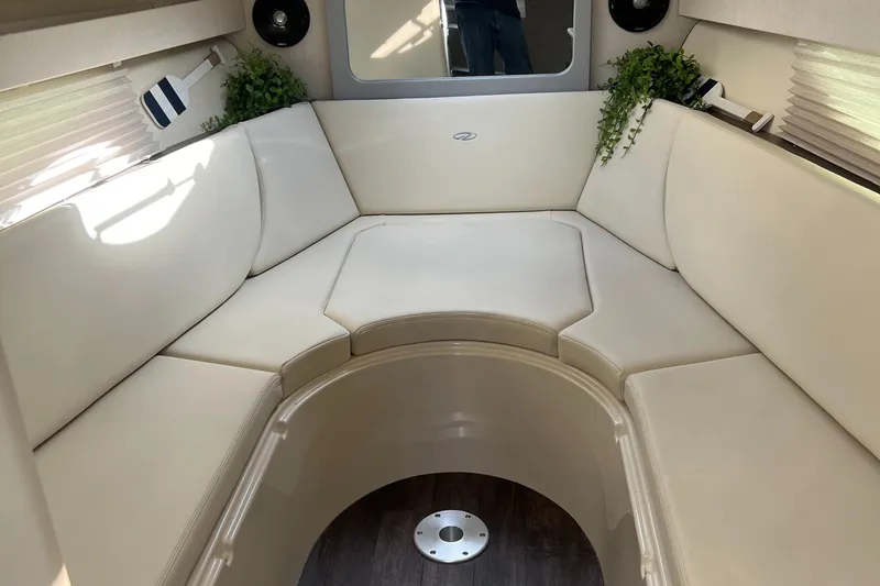 Slide: The Image of 2021 Regal 28 Express cabin interior with beige seating and modern decor. - 7