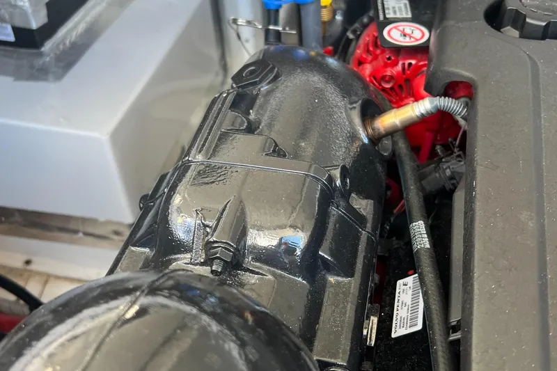 Slide: The Image of 2021 Regal 28 Express engine close-up, showcasing components and wiring. - 9