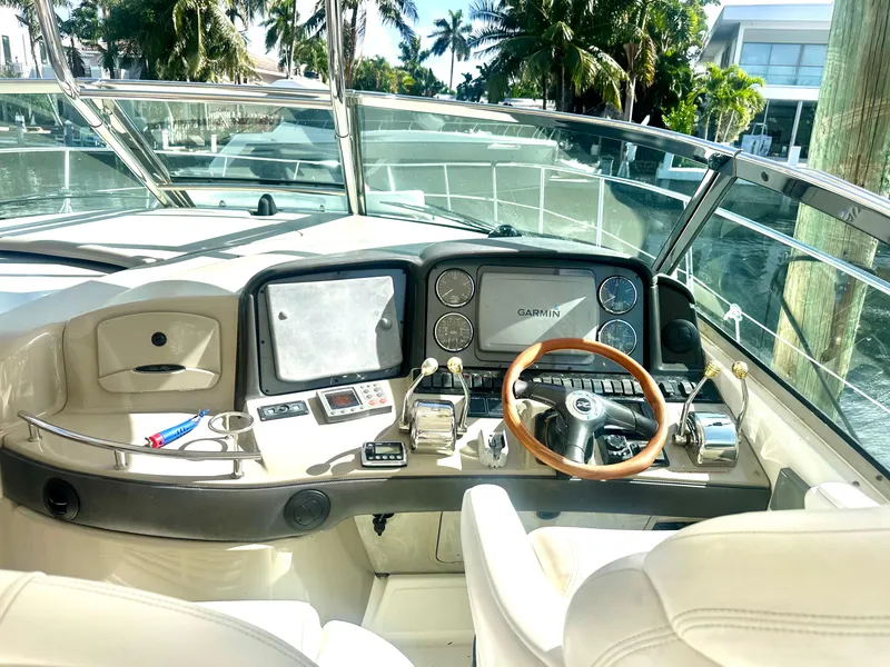 Slide: The Image of Helm of 2005 Sea Ray 420 Sundancer yacht with modern navigation equipment. - 16