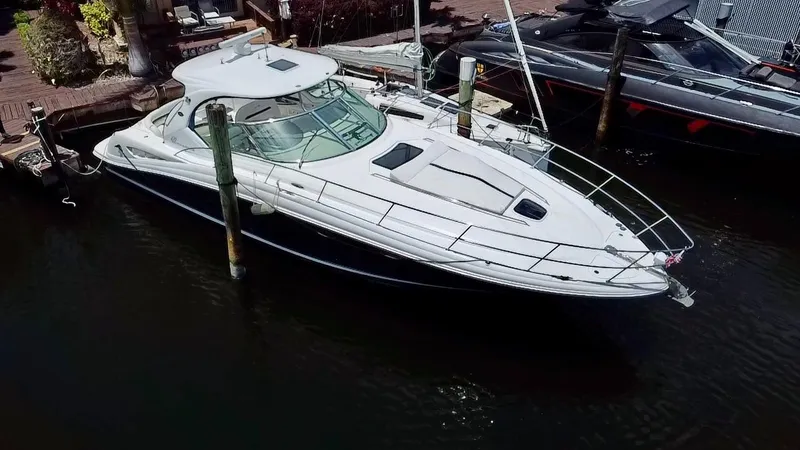 Slide: The Image of 2005 Sea Ray 420 Sundancer yacht docked in marina, aerial view. - 2