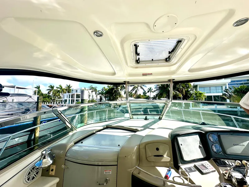 Slide: The Image of Interior view of 2005 Sea Ray 420 Sundancer yacht cockpit with modern controls. - 28