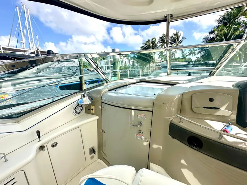 Slide: The Image of Interior view of 2005 Sea Ray 420 Sundancer yacht with clear skies and palm trees. - 29