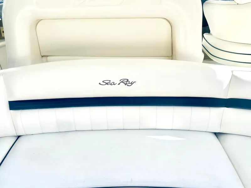 Slide: The Image of Sea Ray 420 Sundancer 2005 boat seating with logo, white upholstery. - 30