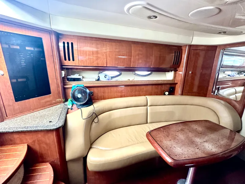 Slide: The Image of Luxurious interior of 2005 Sea Ray 420 Sundancer yacht with leather seating and wood finishes. - 35