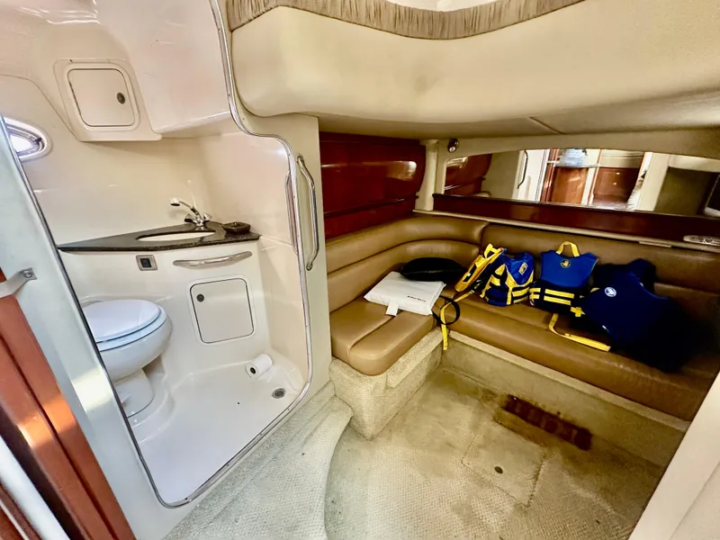 Slide: The Image of 2005 Sea Ray 420 Sundancer cabin interior with bathroom and seating area. - 40