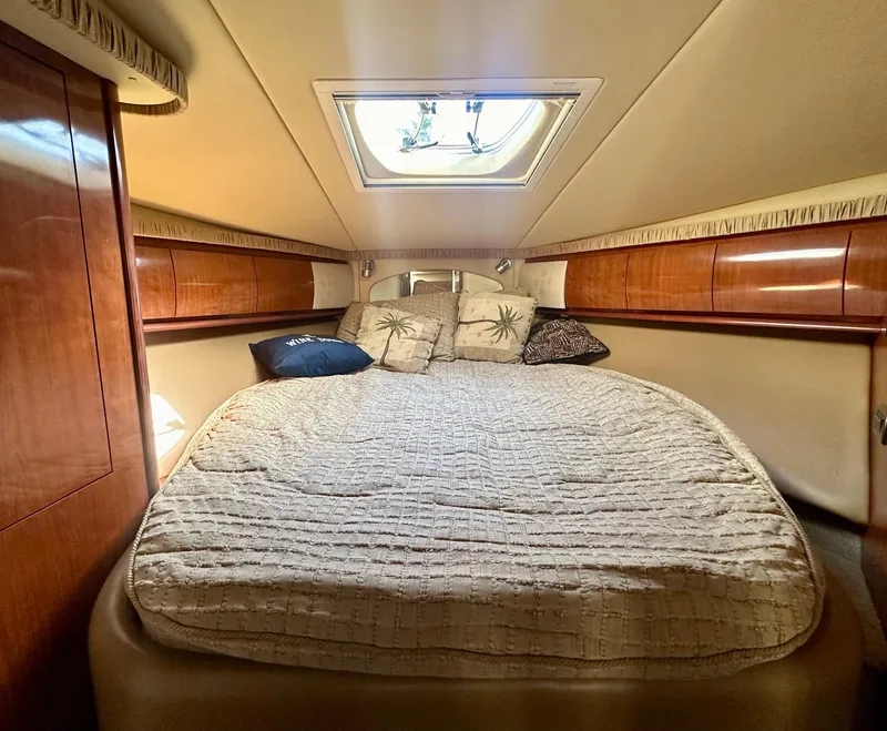 Slide: The Image of Luxurious cabin interior of 2005 Sea Ray 420 Sundancer yacht with cozy bedding. - 42