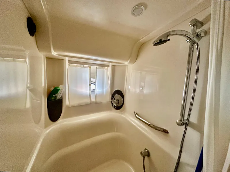 Slide: The Image of Luxurious bathroom in 2005 Sea Ray 420 Sundancer yacht with modern shower amenities. - 45