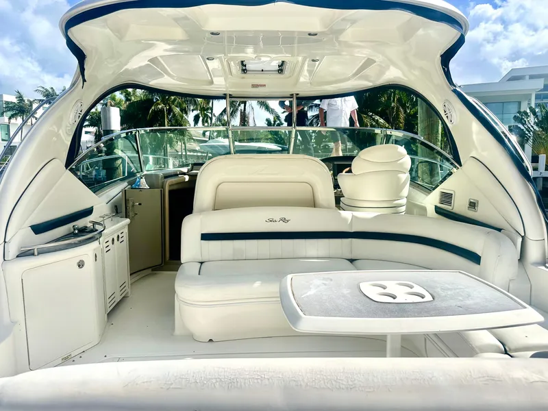 Slide: The Image of Luxurious 2005 Sea Ray 420 Sundancer yacht interior with plush seating and table. - 6