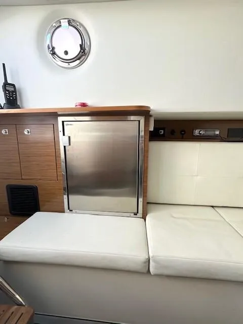 Slide: The Image of 2016 Cruisers Sport Series 328CX interior with seating and storage. - 13